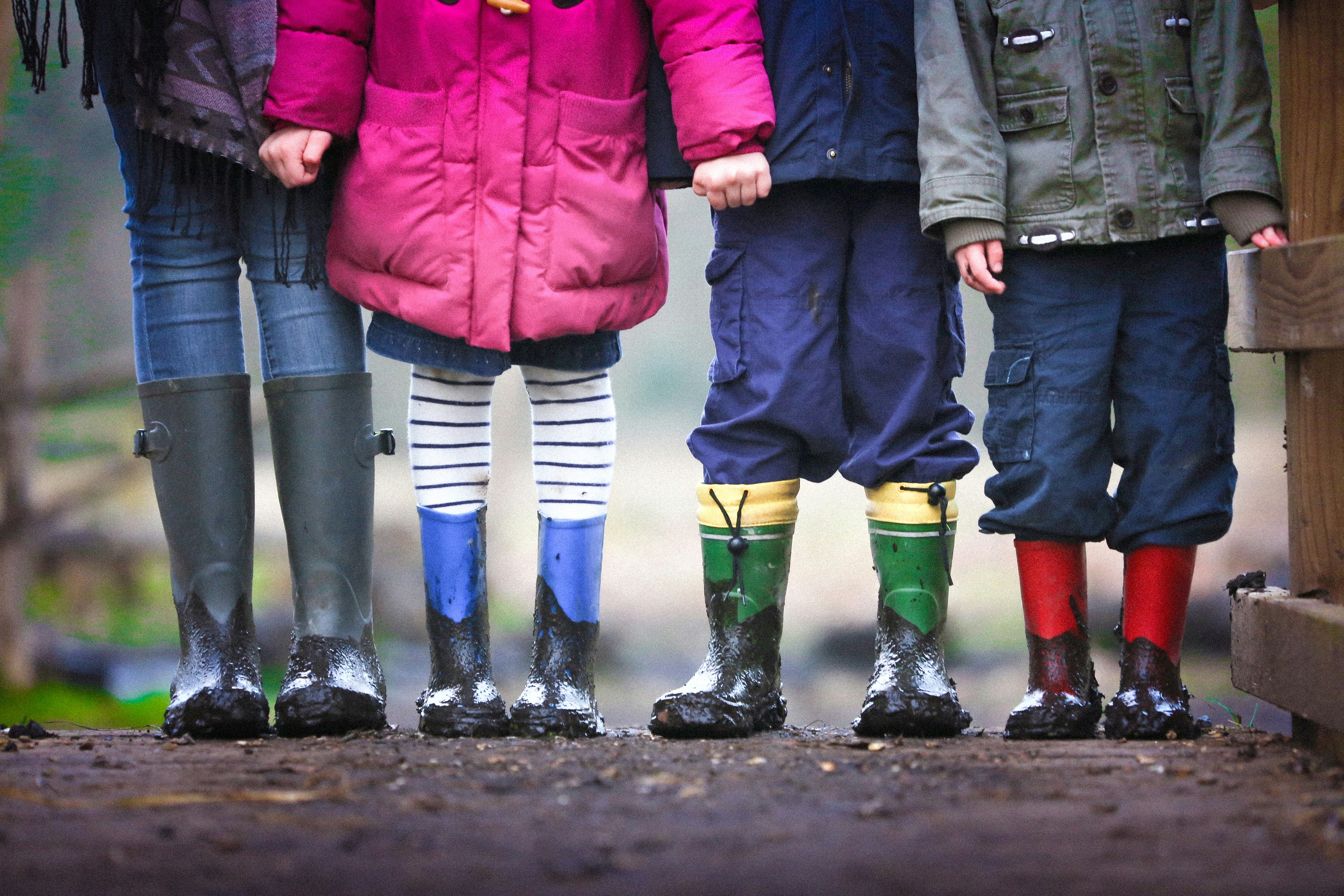 Various aged children wearing wellington boots